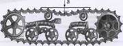 Каким должно быть осевое перемещение (а) направляющего колеса гусеничной самоходной машины? - student2.ru